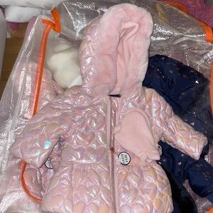 Brand new pink puffy coat with heart shape all over